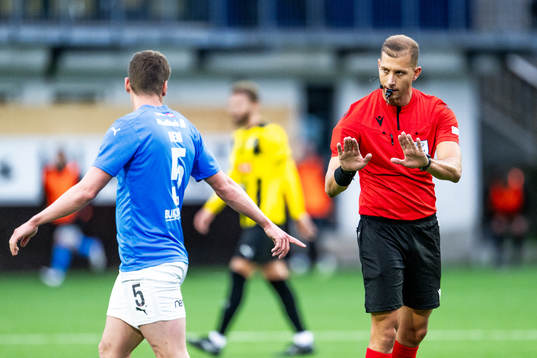 Deni Pavlović of Klaksvik reacts and referee Michal Ocenás
