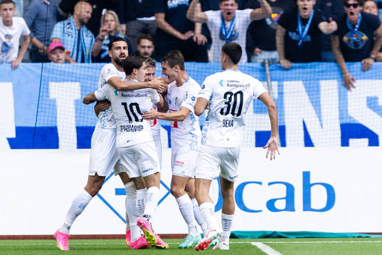 Kemal Ademi of Luzern celebrates with team