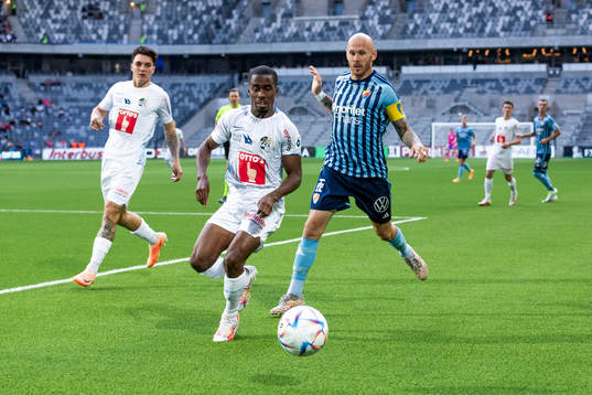Teddy Okou of Luzern and Magnus Eriksson of Djurgården