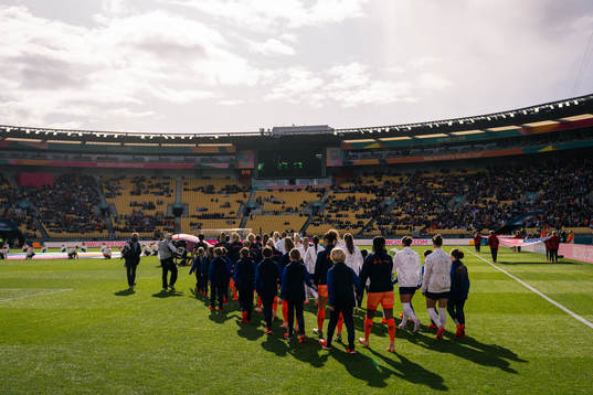 Players of Netherlands and of USA enter the pitch