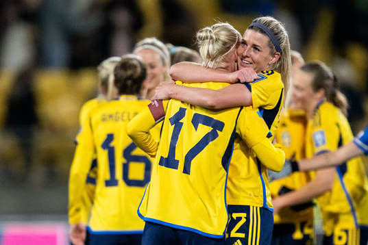 Caroline Seger and Olivia Schough of Sweden celebrate