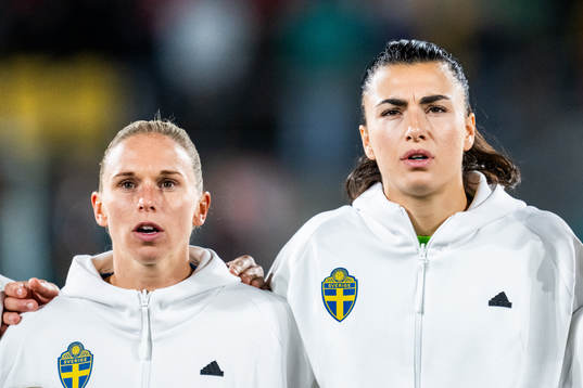 Jonna Andersson and goalkeeper Zecira Musovic of Sweden