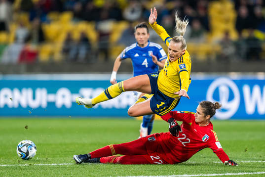 Stina Blackstenius of Sweden falls in a duel with
