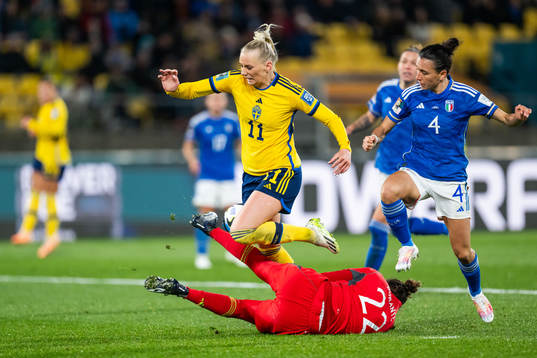 Stina Blackstenius of Sweden fall in a duel with goalkeeper