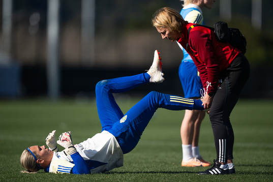 Goalkeeper Jennifer Falk receives treatment from physio