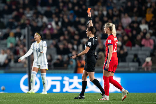 Referee Marie-Soleil Beaudoin shows a red card to Sofia