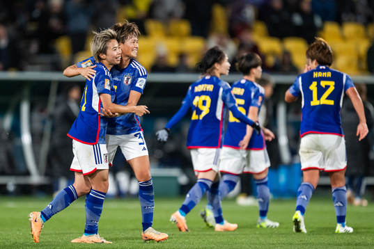 Mina Tanaka of Japan celebrates with Moeka Minami