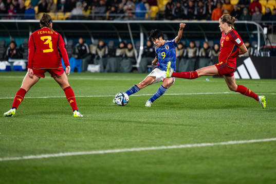 Riko Ueki of Japan scores 2-0 competing with Irene Paredes