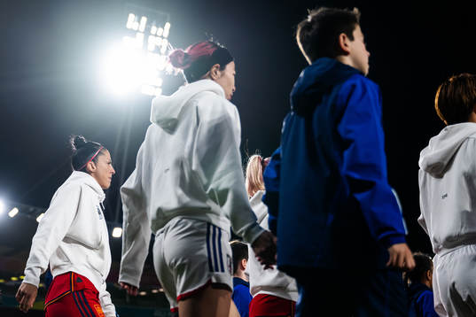 Jennifer Hermoso of Spain and Jun Endo of Japan enter the