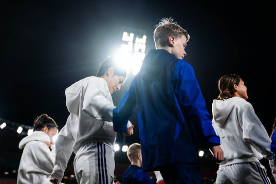 Hikaru Naomoto of Japan enters the pitch