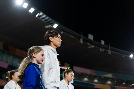 Saki Kumagai of Japan enters the pitch