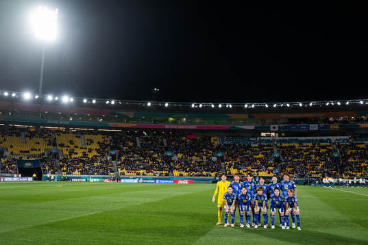 The starting eleven of Japan pose for a photo