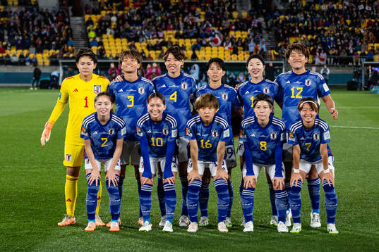 The starting eleven of Japan pose for a photo
