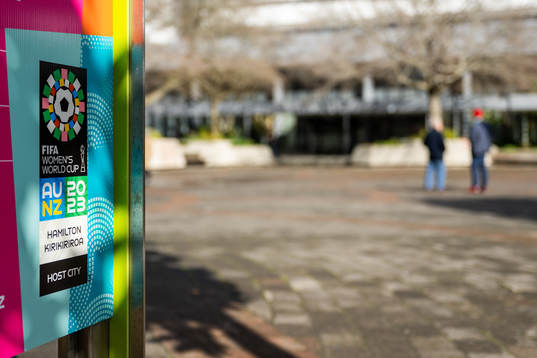 A sign in Hamilton Square with the logo for the FIFA