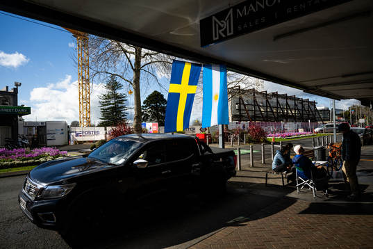 A Swedish and an Argentinian flag