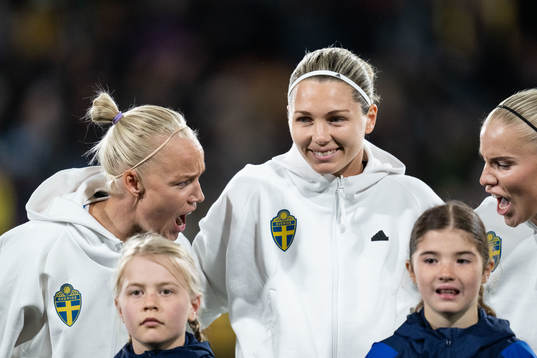 Caroline Seger and goalkeeper Jennifer Falk of Sweden