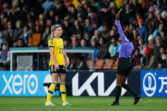 Olivia Schough of Sweden receives a yellow card from