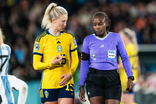 Rebecka Blomqvist of Sweden in discussion with  referee