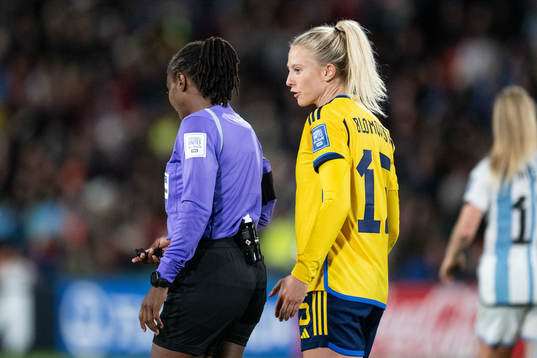 Rebecka Blomqvist of Sweden in discussion with  referee