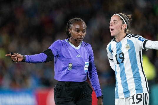 Referee Salima Mukansanga and Mariana Larroquette of