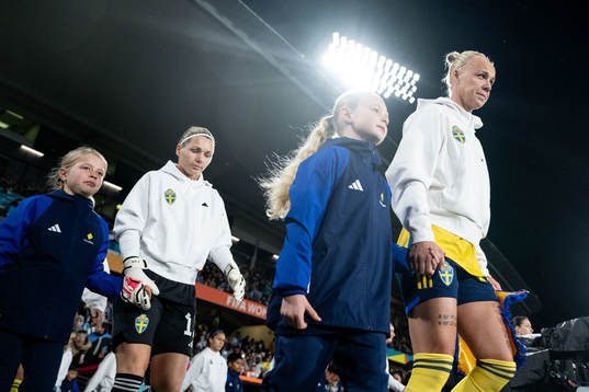 Goalkeeper Jennifer Falk and Caroline Seger of Sweden