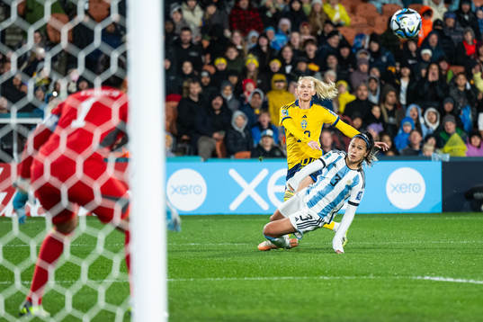 Sofia Jakobsson of Sweden passes past Eliana Stabile of