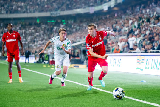 Markus Karlsson of Hammarby and Alfons Sampsted of Twente