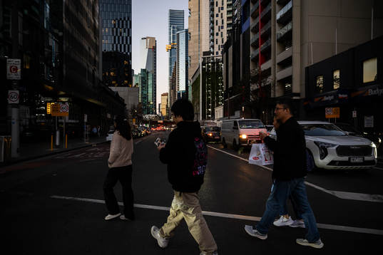 People cross a street