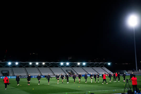 Players warm up at a training session with the women's