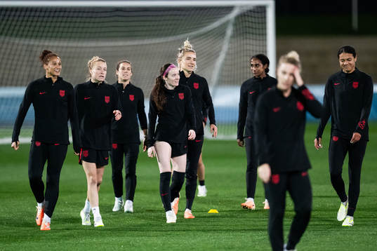 Rose Lavelle (middle) with team mates at a training session
