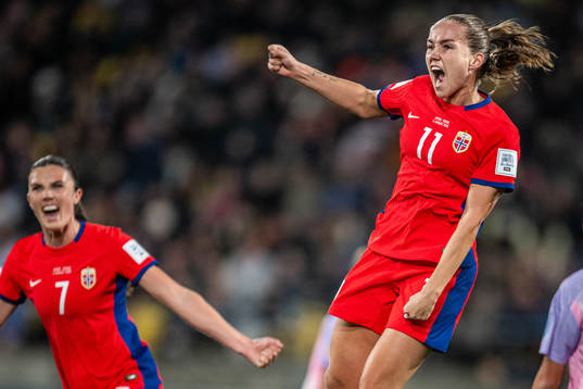 Ingrid Syrstad Engen and Guro Reiten of Norway celebrate
