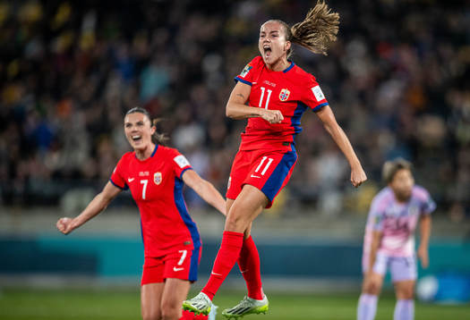 Ingrid Syrstad Engen and Guro Reiten of Norway celebrates