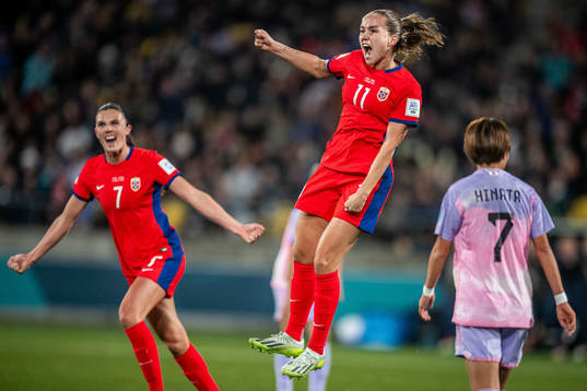 Ingrid Syrstad Engen and Guro Reiten of Norway celebrate