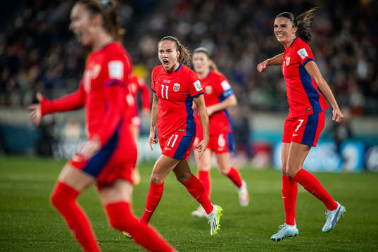 Ingrid Syrstad Engen and Guro Reiten of Norway celebrates