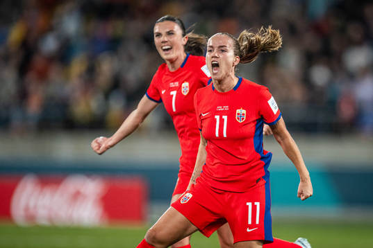 Ingrid Syrstad Engen and Guro Reiten of Norway celebrates