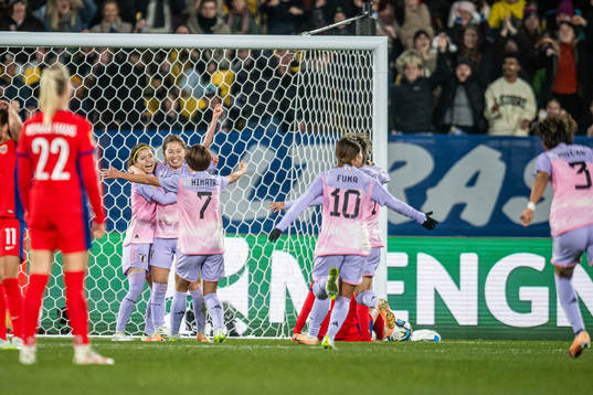 Players of Japan celebrate 2-1