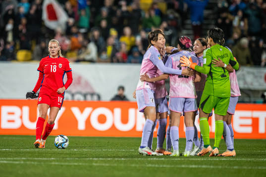 Frida Maanum of Norway looks dejected while players of