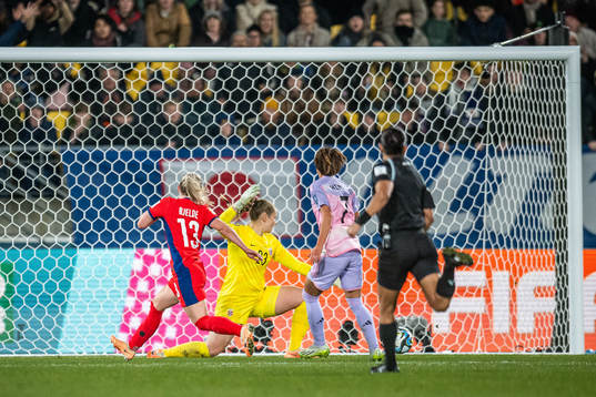 Hinata Miyazawa of Japan scores 3-1 behind goalkeeper