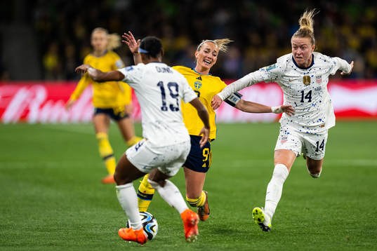 Kosovare Asllani of Sweden and Emily Sonnett of USA