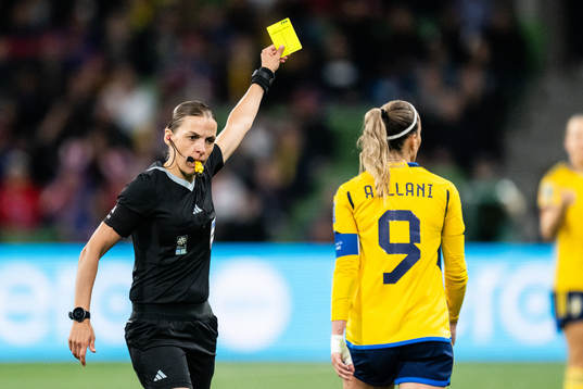 Kosovare Asllani of Sweden is shown a yellow card by