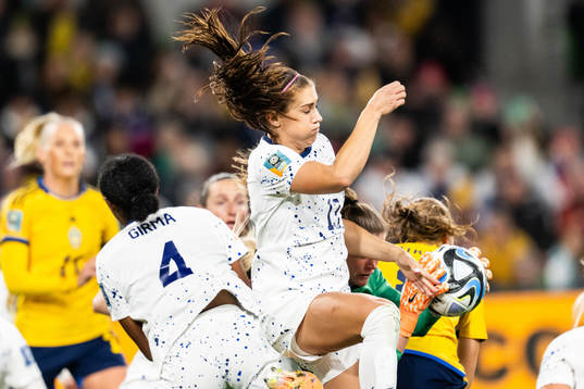 Alex Morgan and goalkeeper Alyssa Naeher of USA