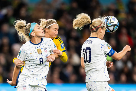 Julie Ertz and Lindsey Horan of USA against Amanda Ilestedt