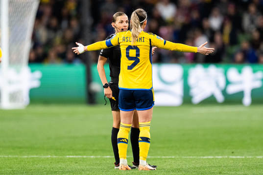 Referee Stephanie Frappart and Kosovare Asllani of Sweden