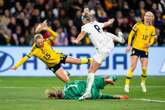 Rebecka Blomqvist of Sweden against goalkeeper Alyssa