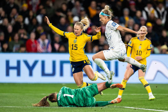 Rebecka Blomqvist of Sweden against goalkeeper Alyssa