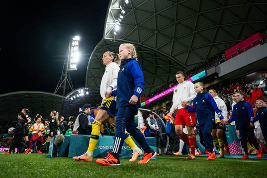 Kosovare Asllani and goalkeeper Zecira Musovic of Sweden
