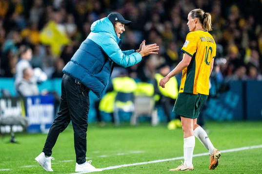 Head coach Tony Gustavsson and Emily van Egmond of Australia