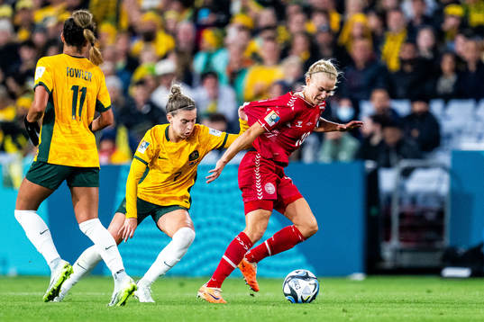 Steph Catley of Australia and Pernille Harder of Denmark