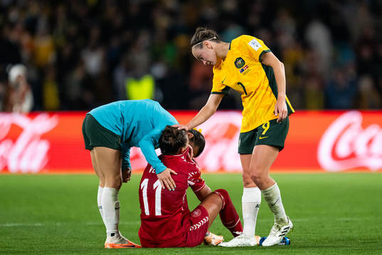 Katrine Veje of Denmark looks dejected and is consoled by