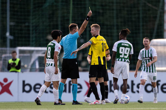 Samuel Gustafson of Häcken receives a yellow card from